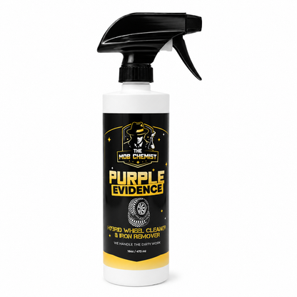 A bottle of The Mob Chemist Purple Evidence Hybrid Wheel Cleaner & Iron Remover spray, featuring a black trigger sprayer and a black label with yellow and white text, on a white background.